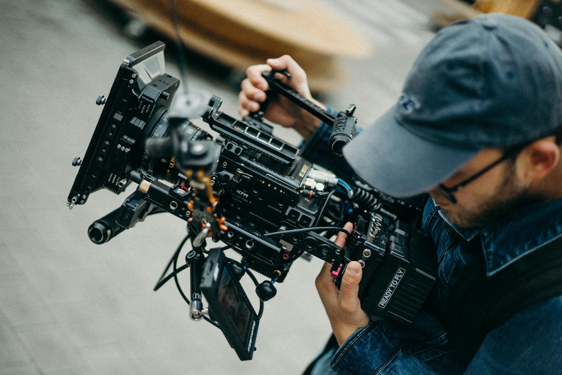 photo of man holding camera