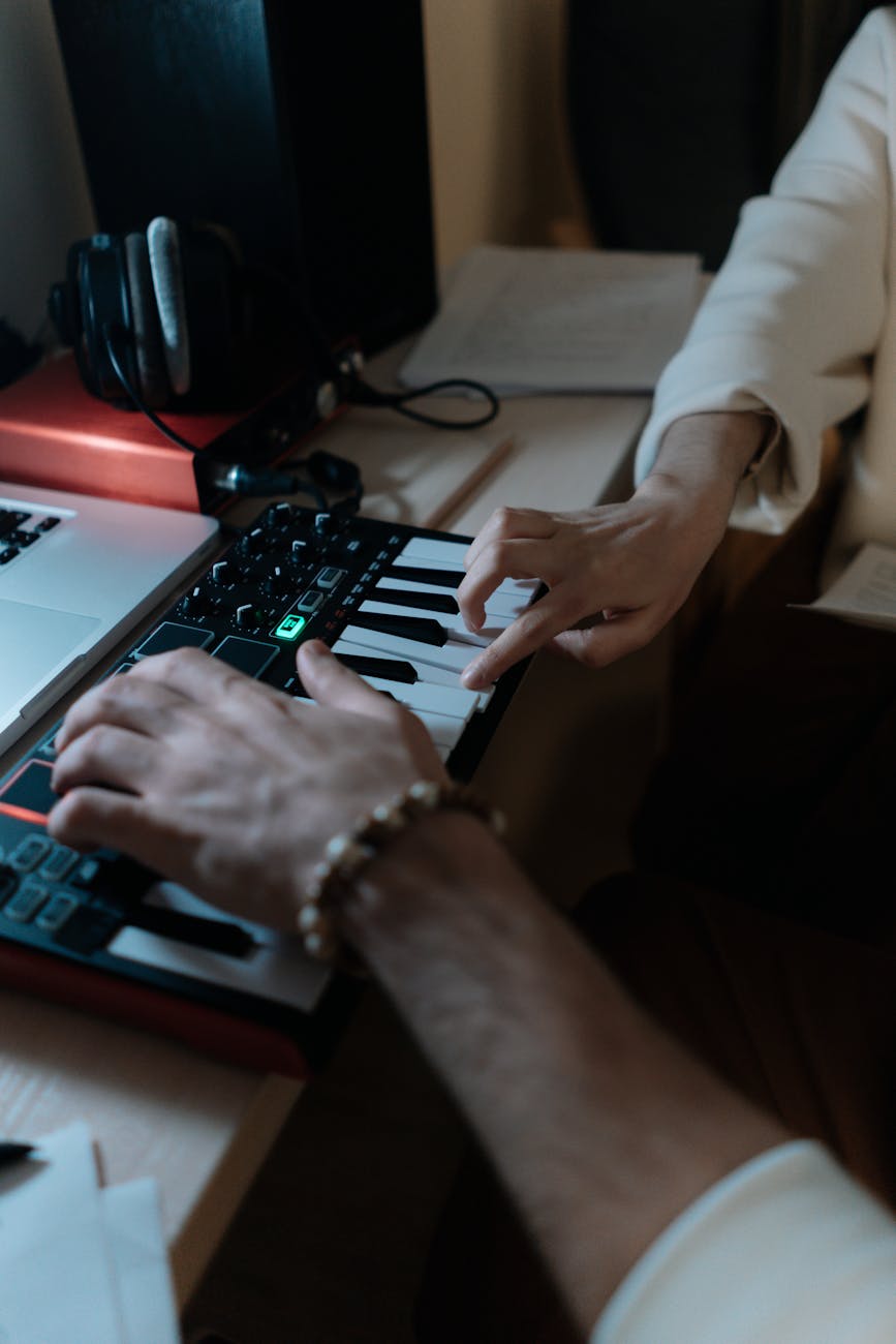 a person s hand touching dj audio mixer