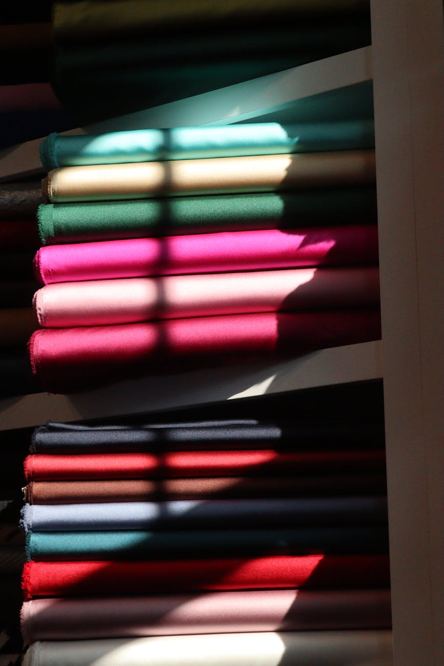 colorful fabric rolls in sunlit store display