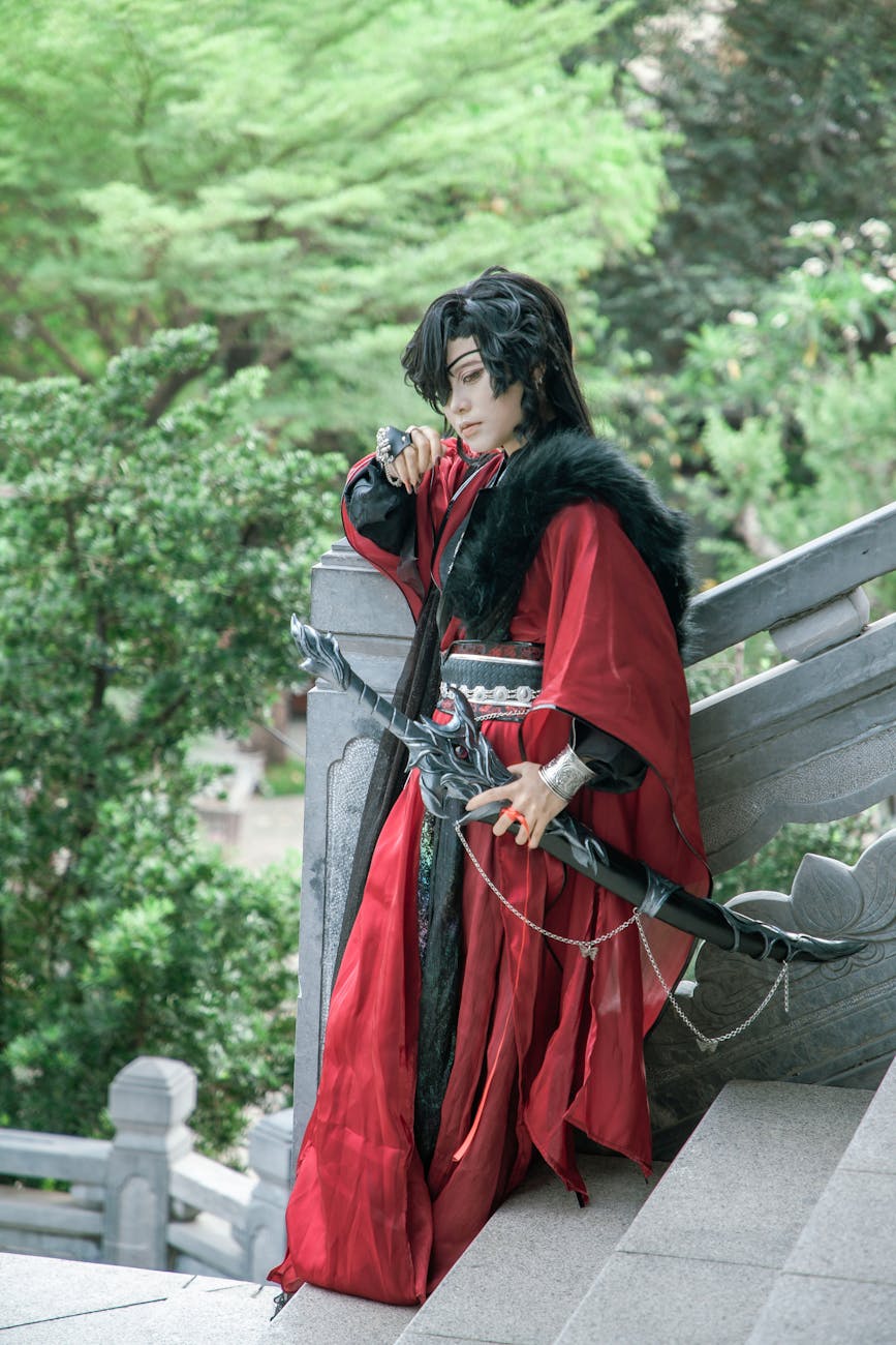 cosplayer in red robe holding katana outdoors, Historical Fiction Manga