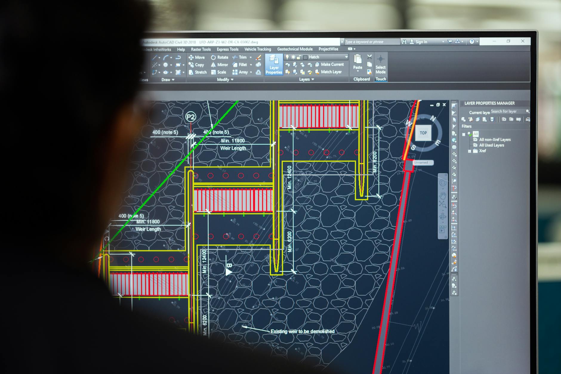 female engineer planning dam