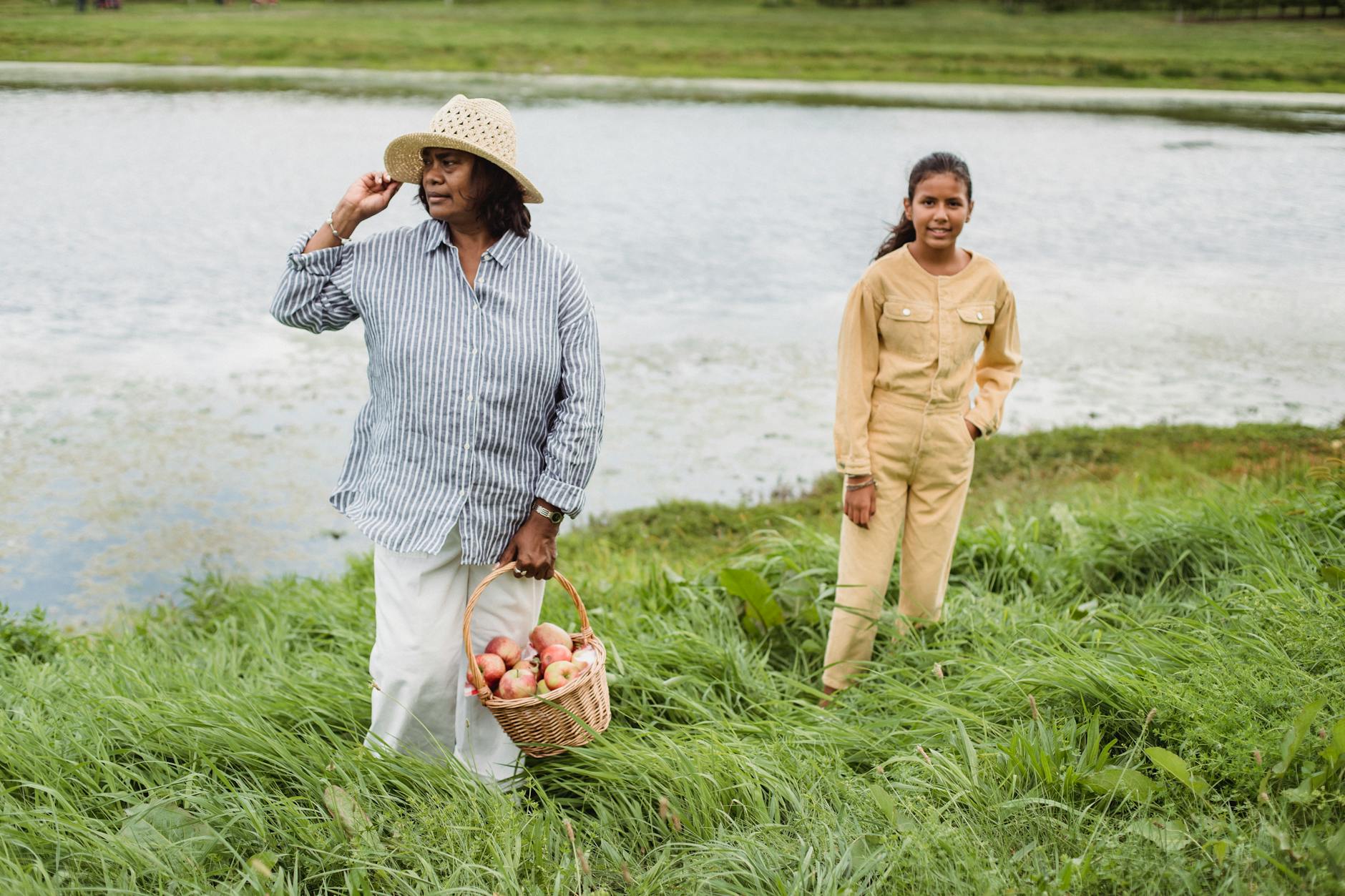 hispanic woman with teen girl near lake, Hispanic and Latin Biographies 