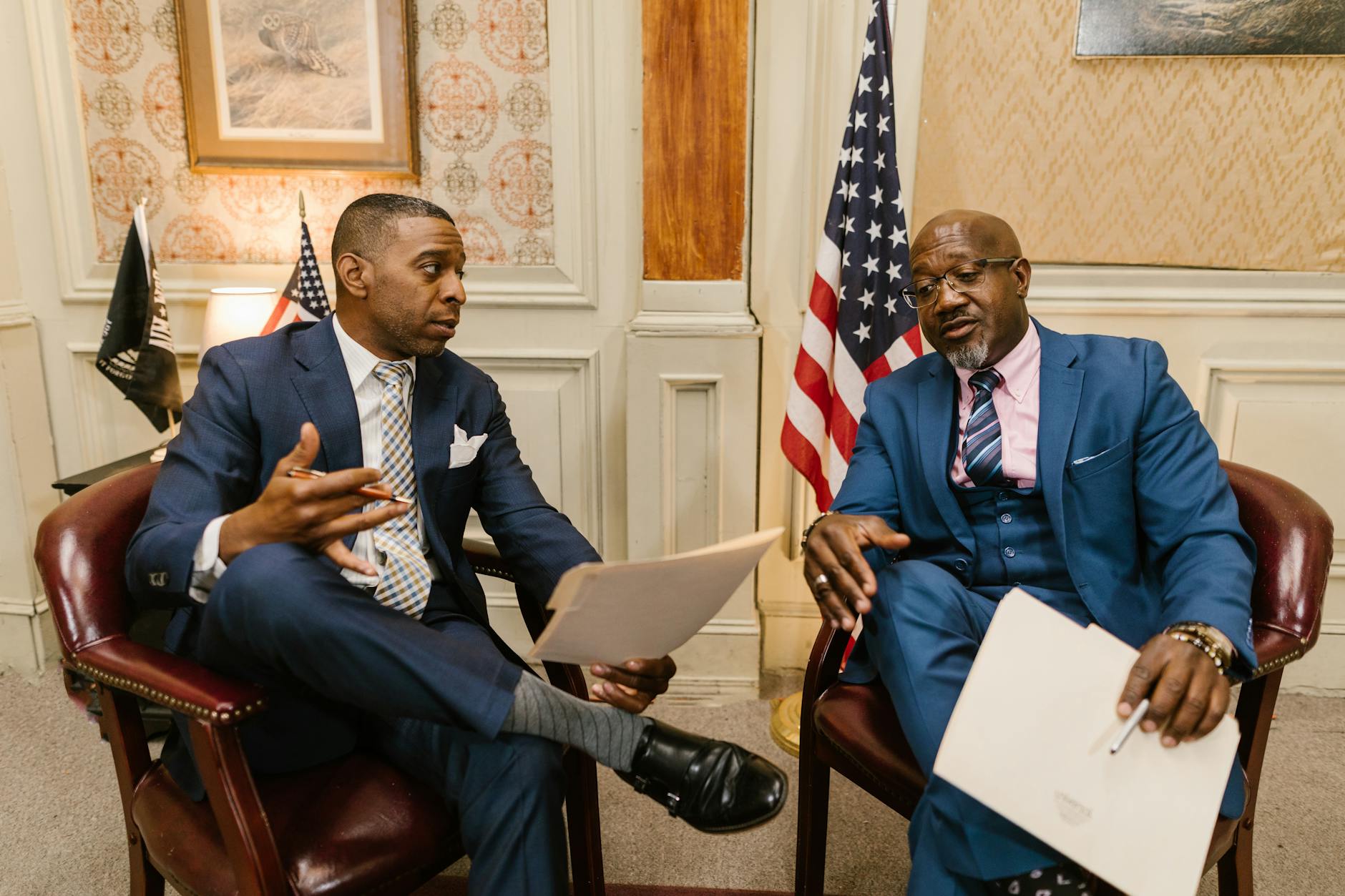 a two men having discussion together, Government and Business