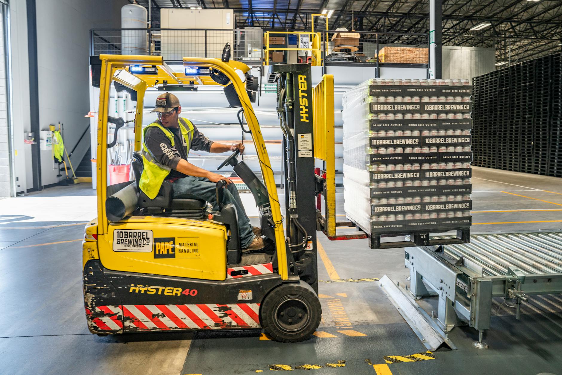 person using forklift, Industrial Packaging 
