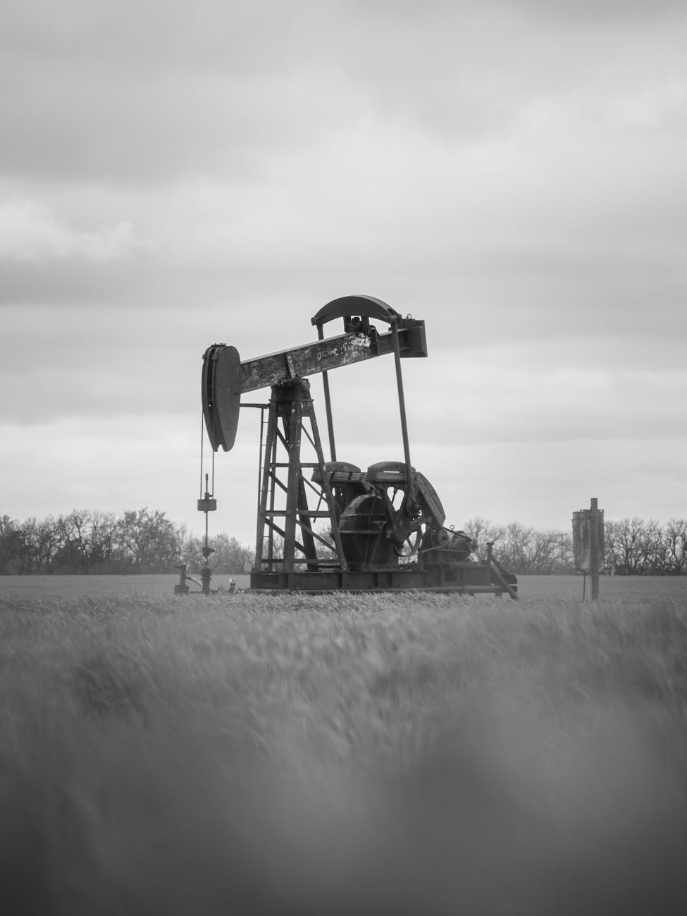 black and white oil pumpjack in kansas field, Geologic Drilling Procedures