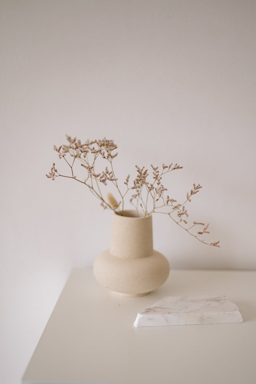 dried flowers in a ceramic vase