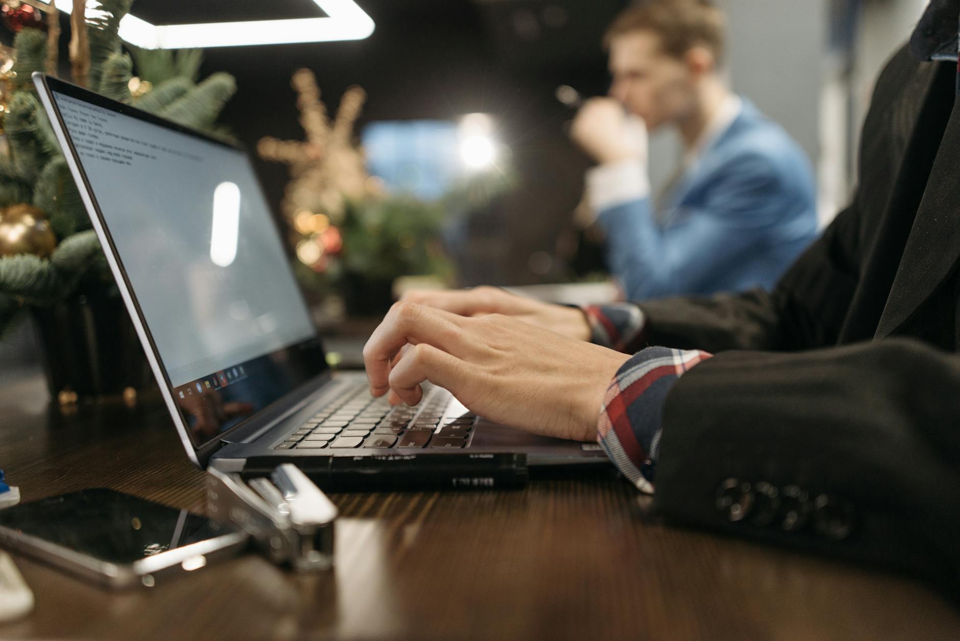 a person typing on the laptop