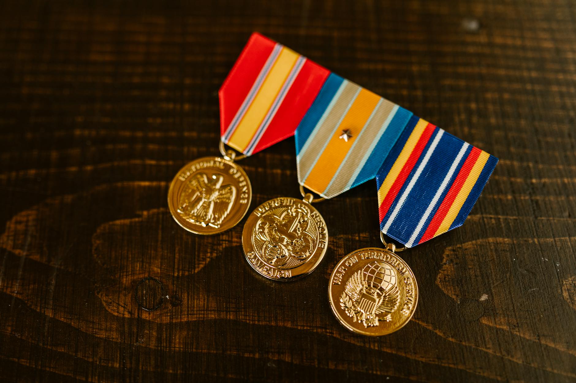 close up photo of medals on wooden surface, Medal Collecting