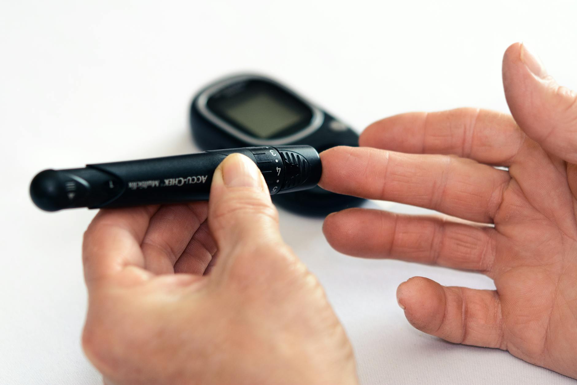 person holding black tube, Diabetes Health