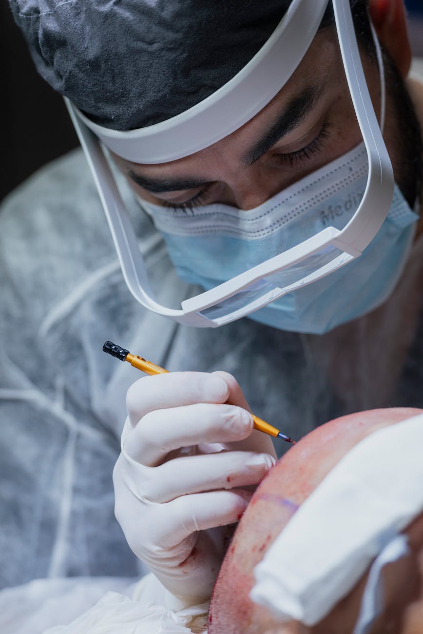 surgeon operating on a patient head