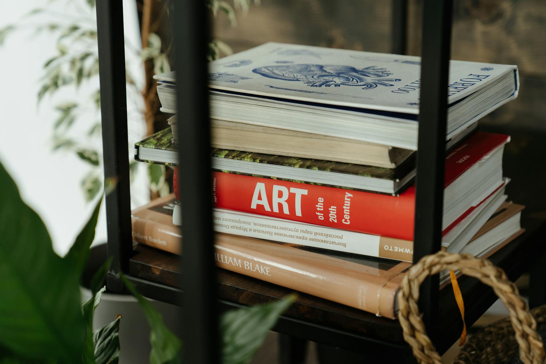 red and brown books on brown woven basket