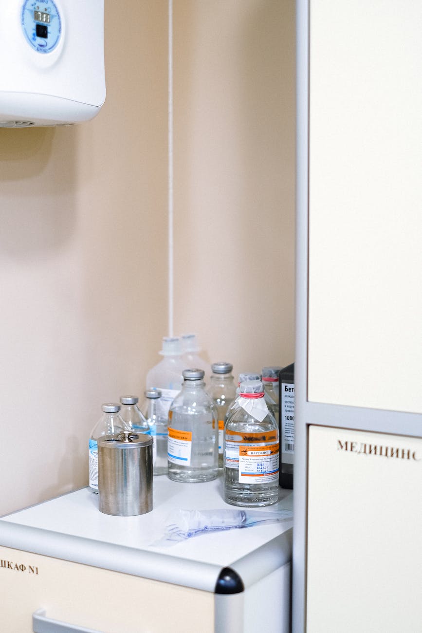 clear plastic bottle beside white wall