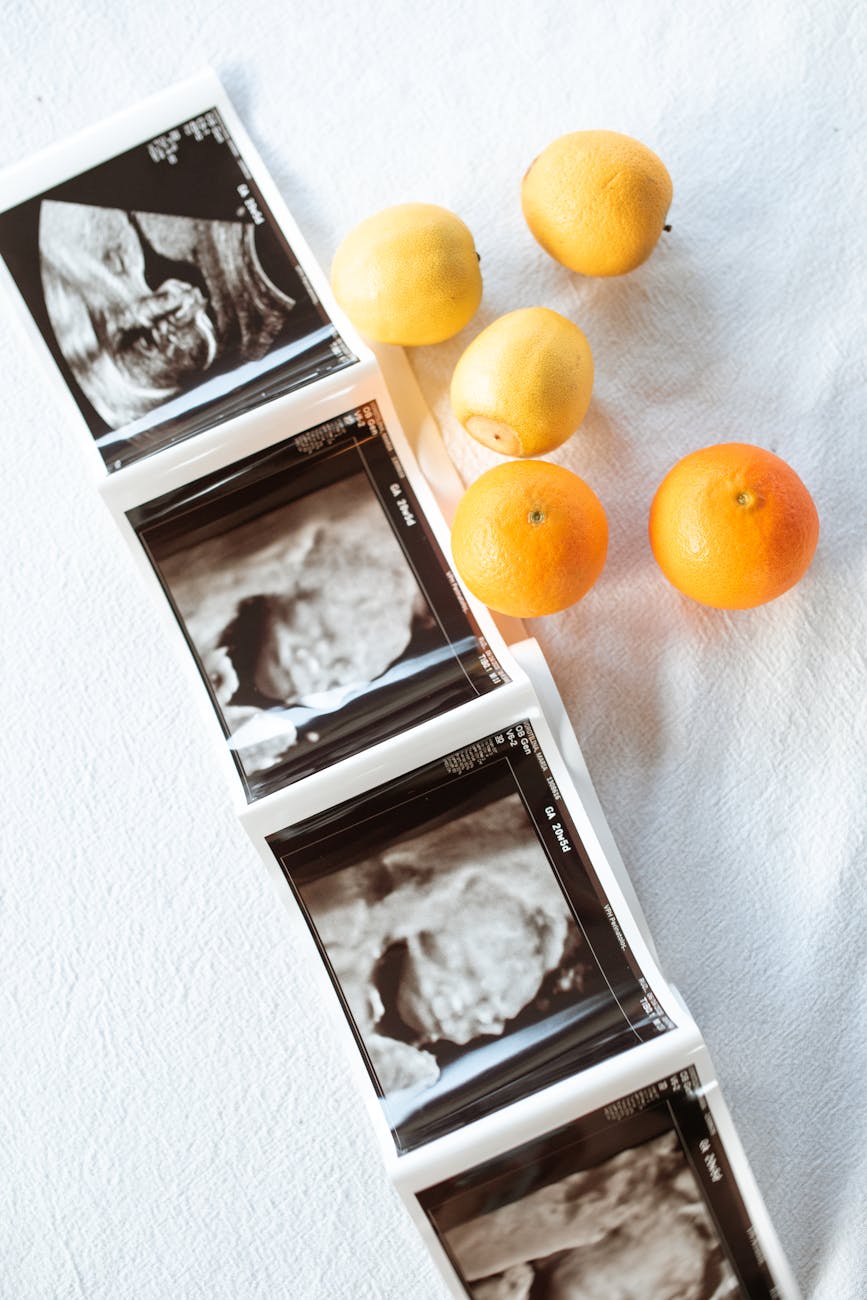 citrus fruits and ultrasound result on white surface