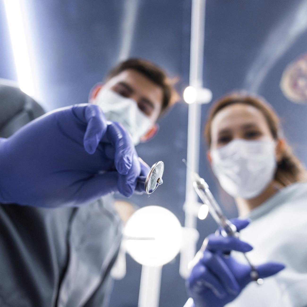 low angle view on doctors with syringe