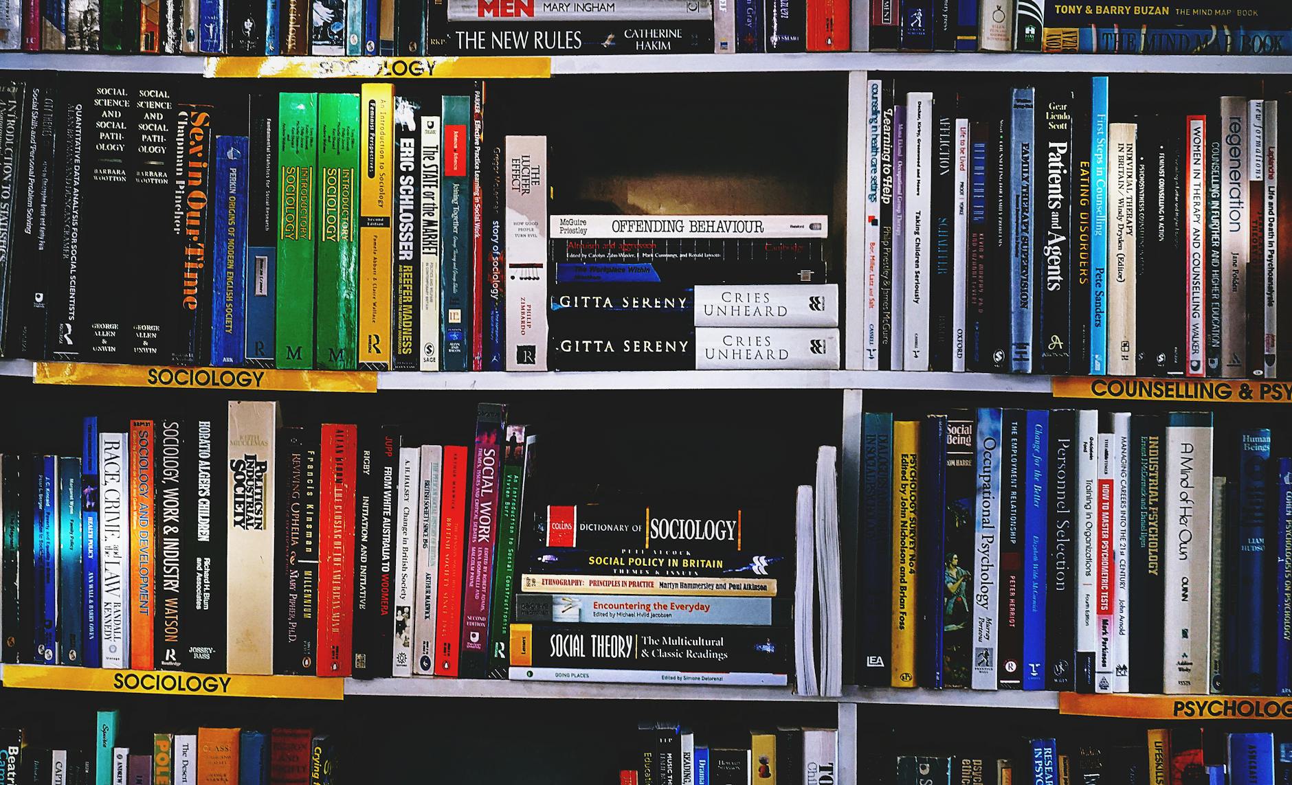 photography of books on bookshelf