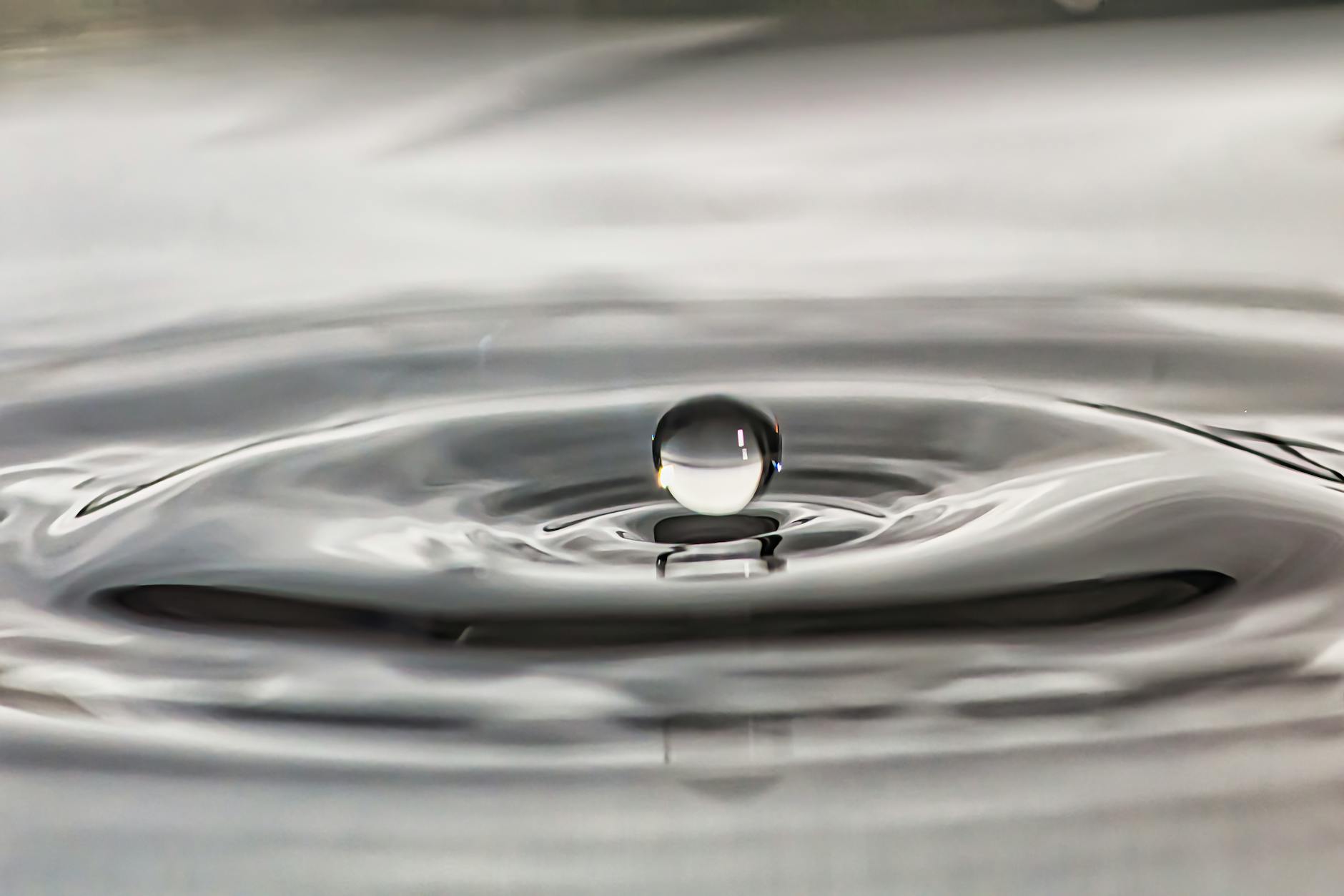 captivating water droplet on rippled surface