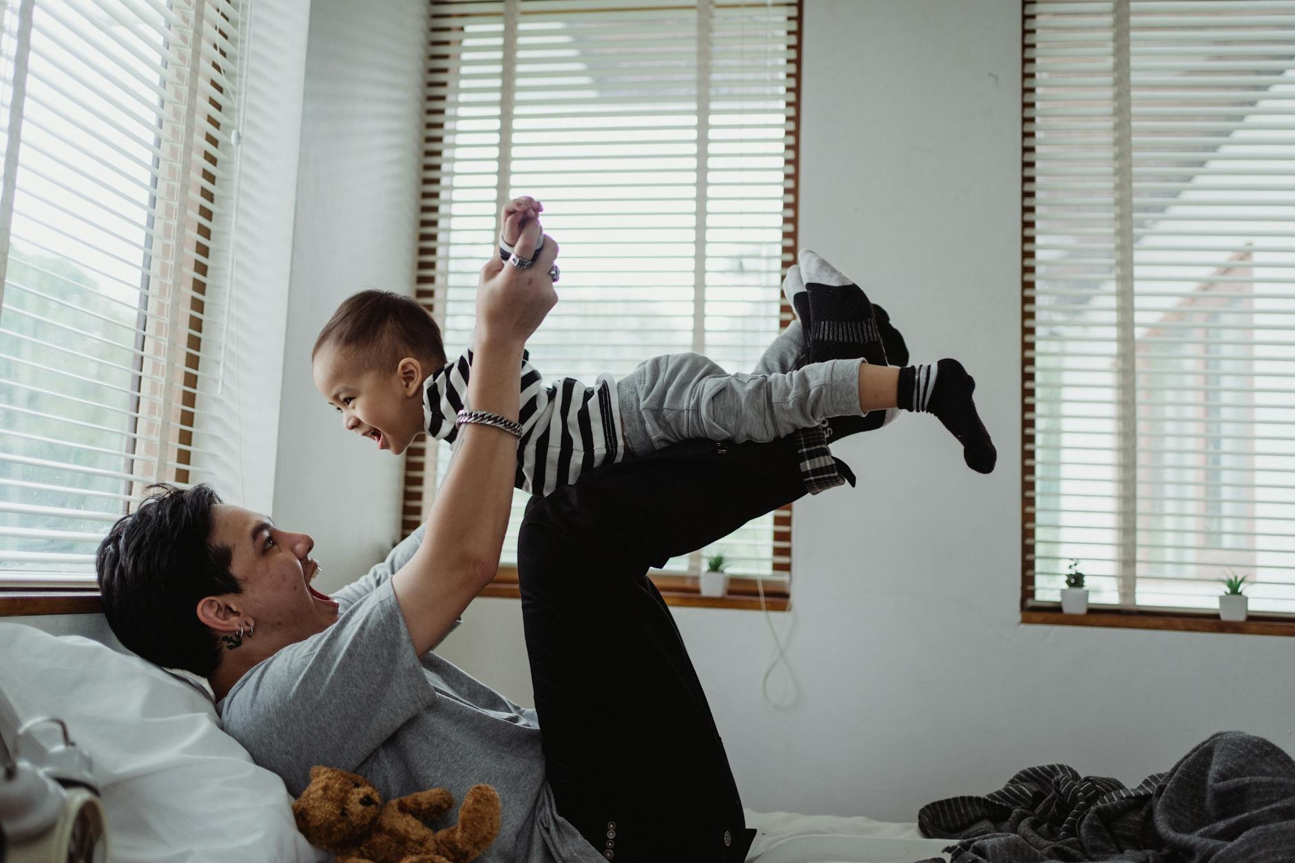 happy father and son playing together