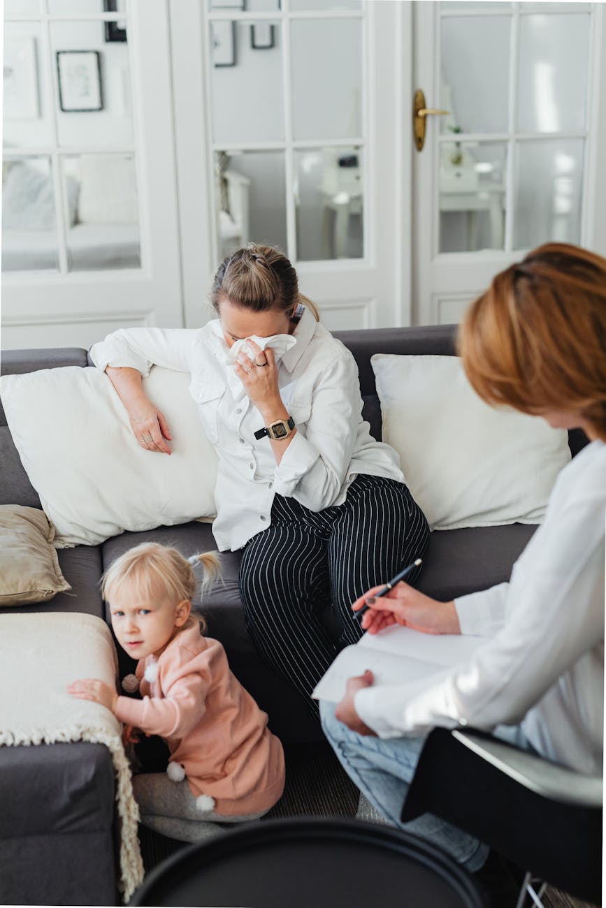 crying woman on sofa and child