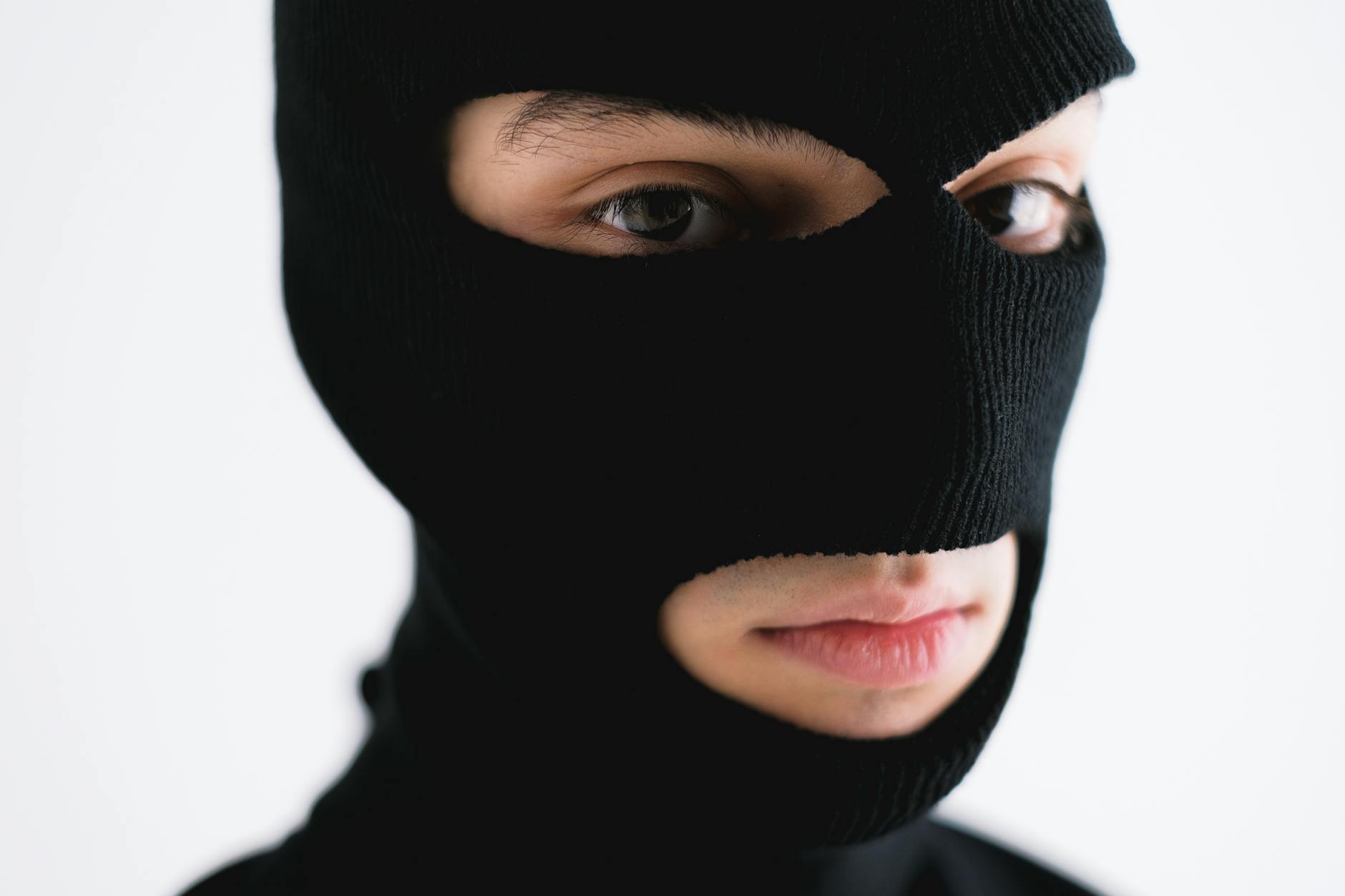 close up shot of a person wearing a robber mask, Heist Thrillers 