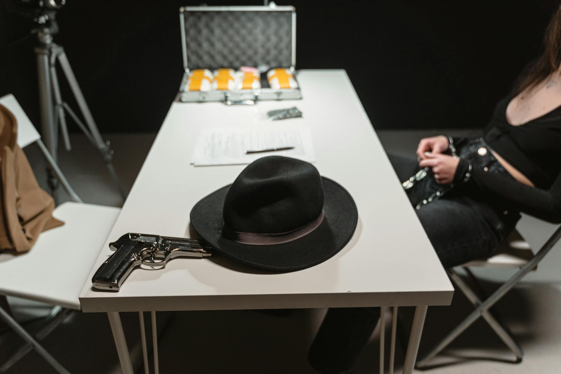 hat and gun on a table