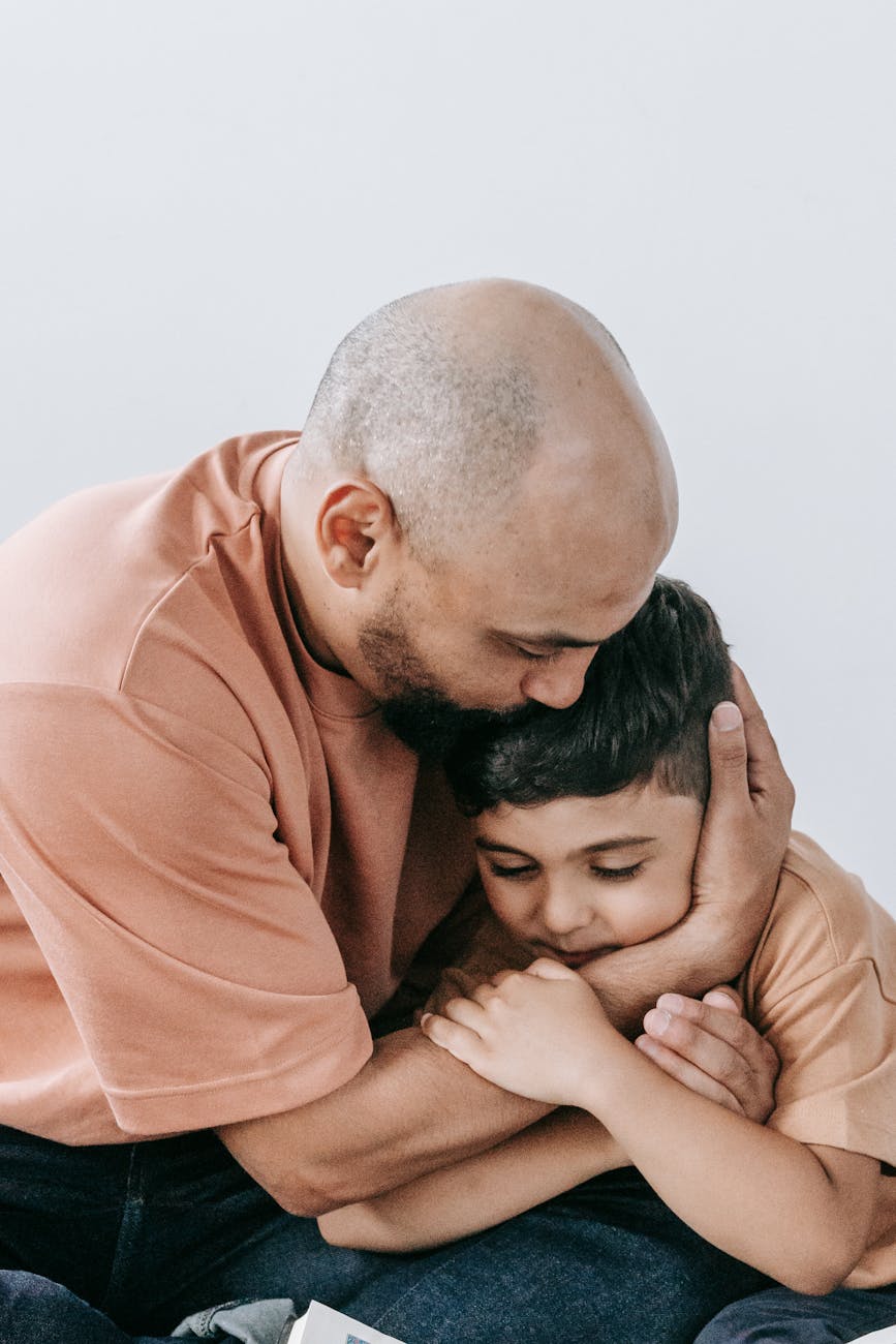 a man hugging his son
