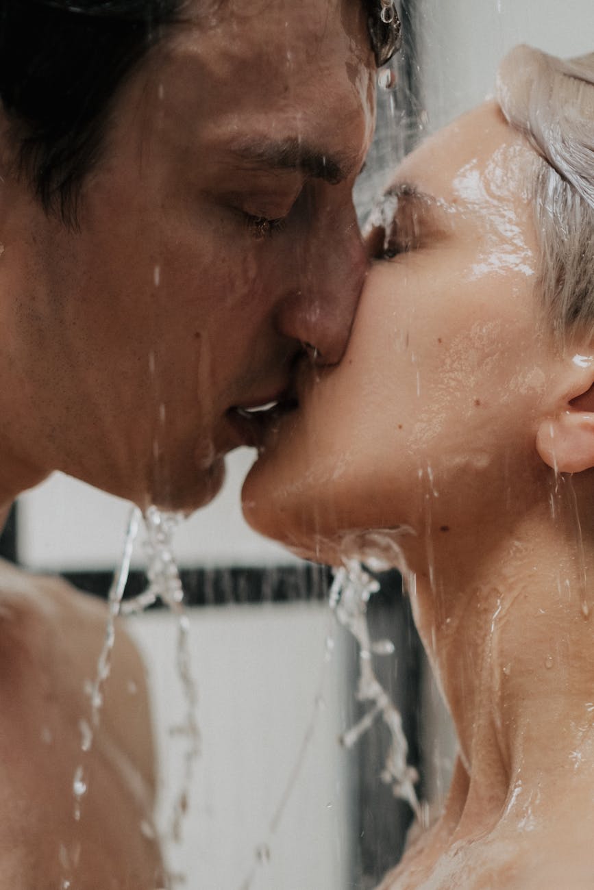 couple passionately kissing in the shower