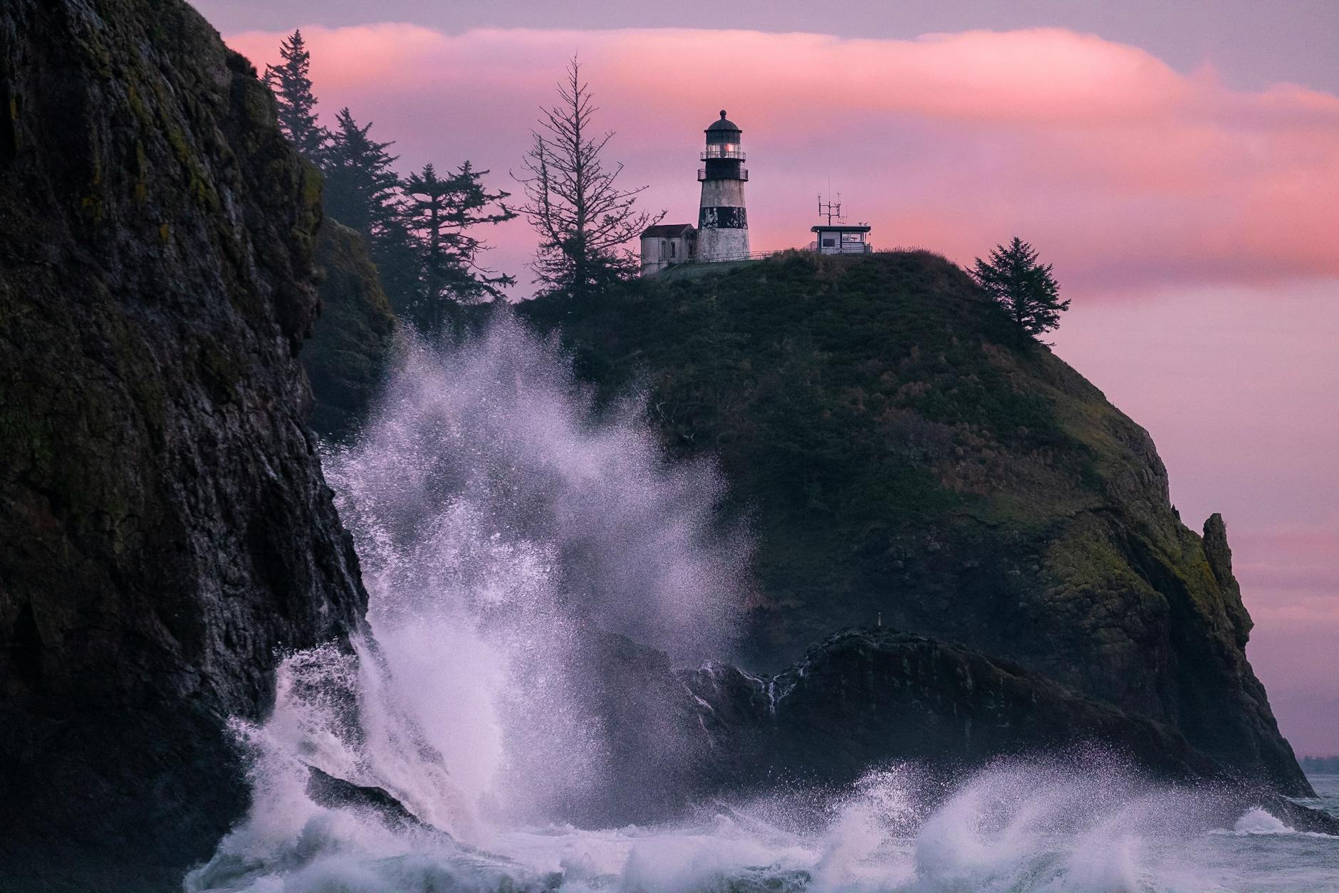 photo of a lighthouse near body of water