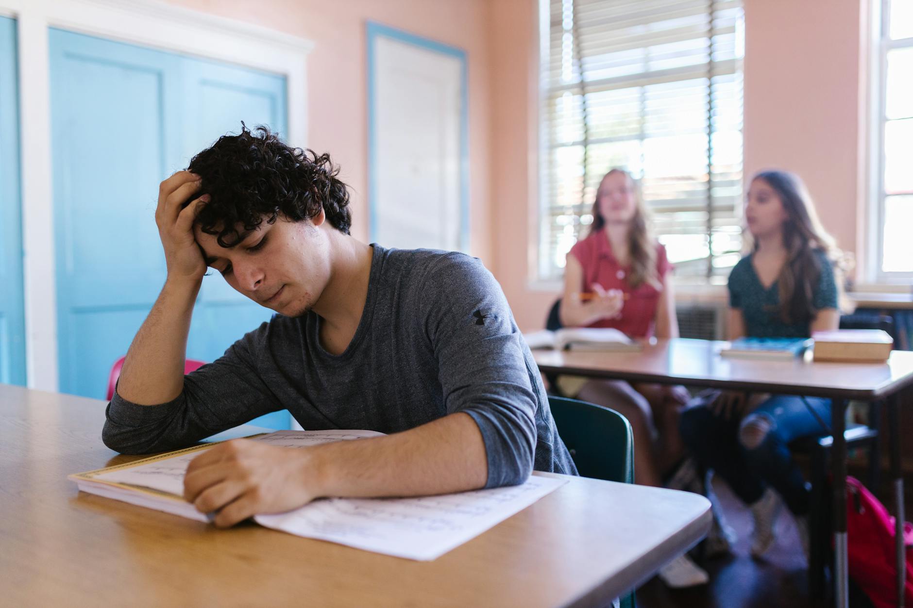 woman in gray long sleeve shirt sitting at the table, Graduate Test Guides