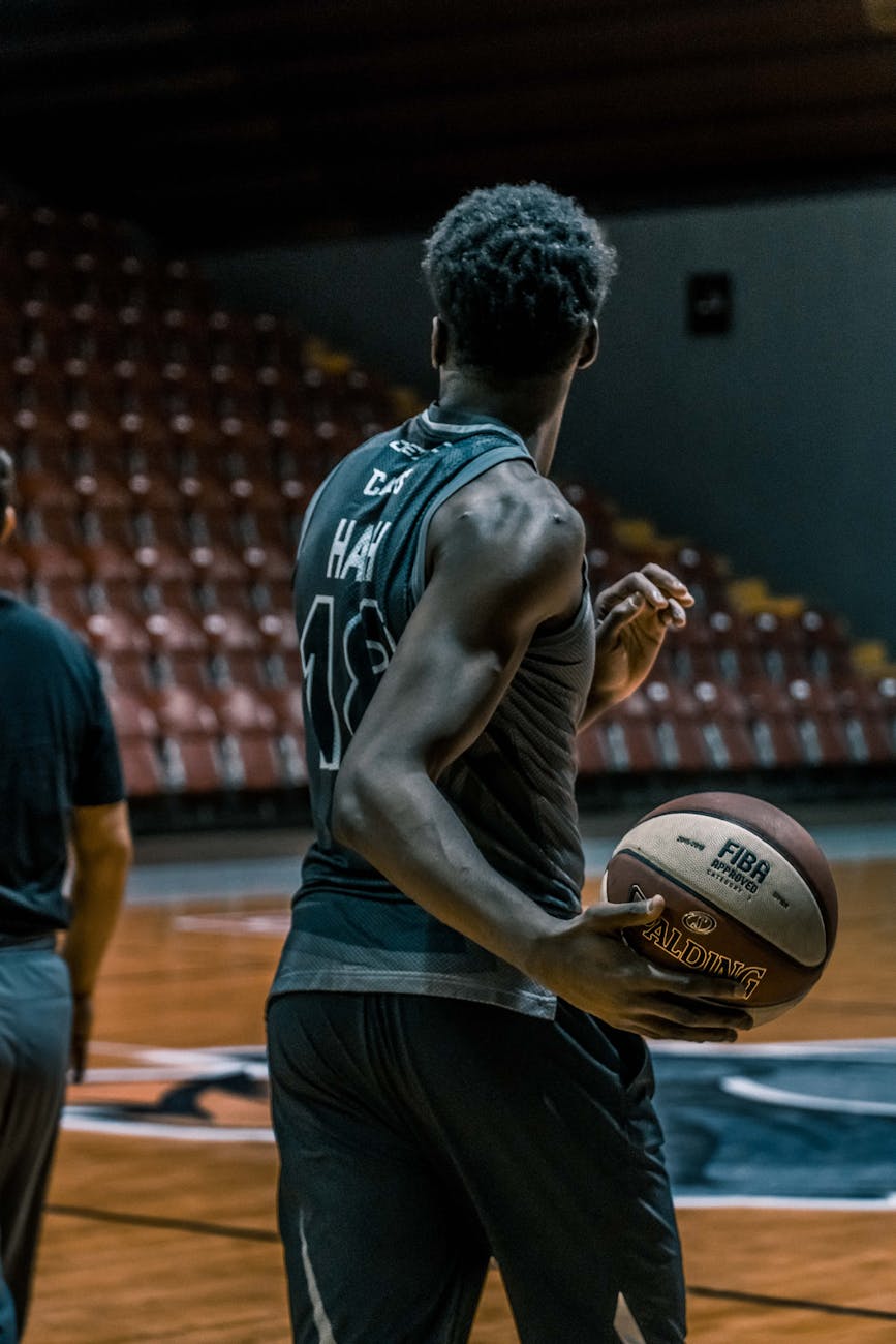 man holding fiba basketball, Professional Basketball