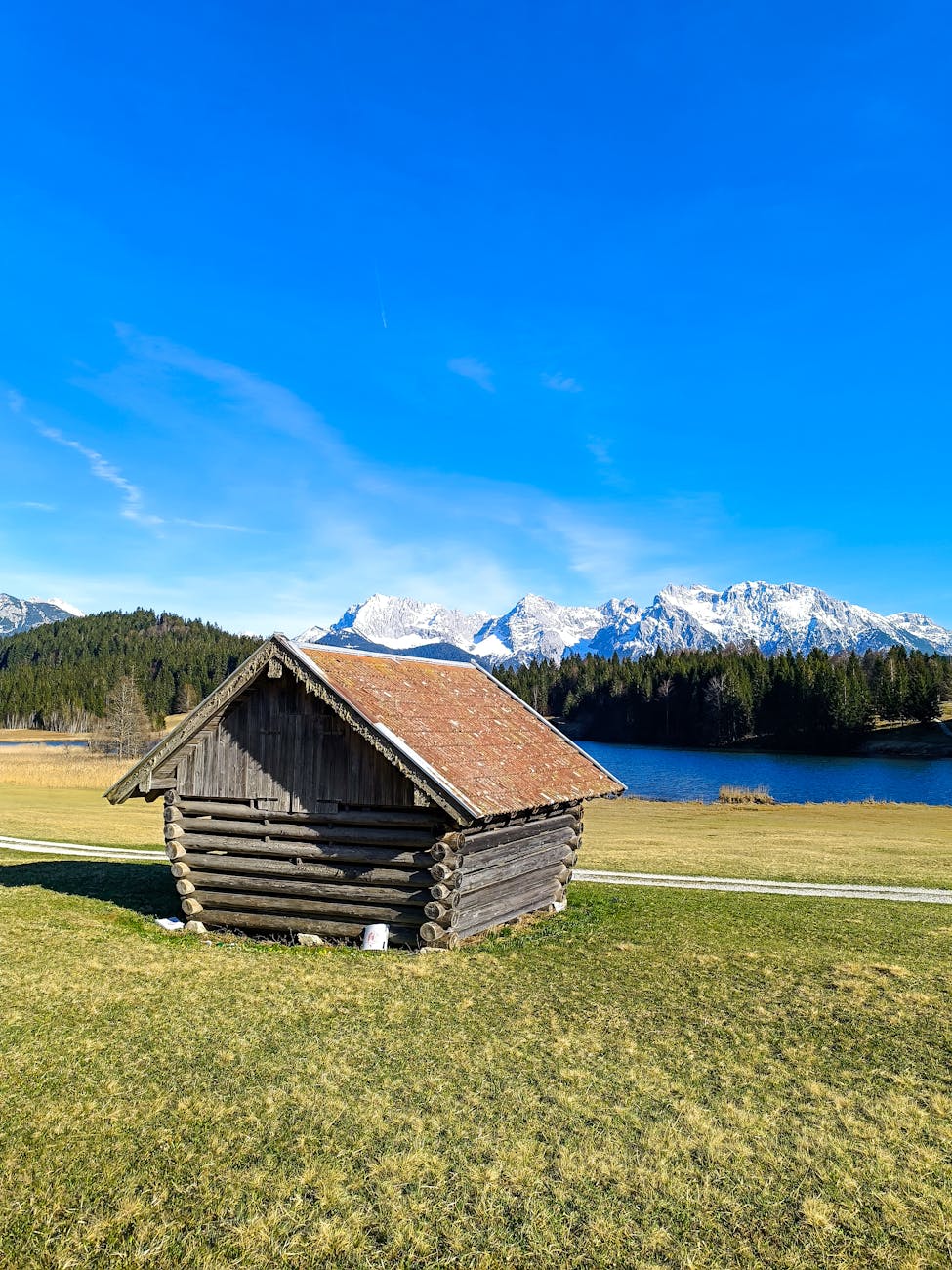 rustic cabin in alpine landscape with snowy mountains, Uncle Tom's Cabin