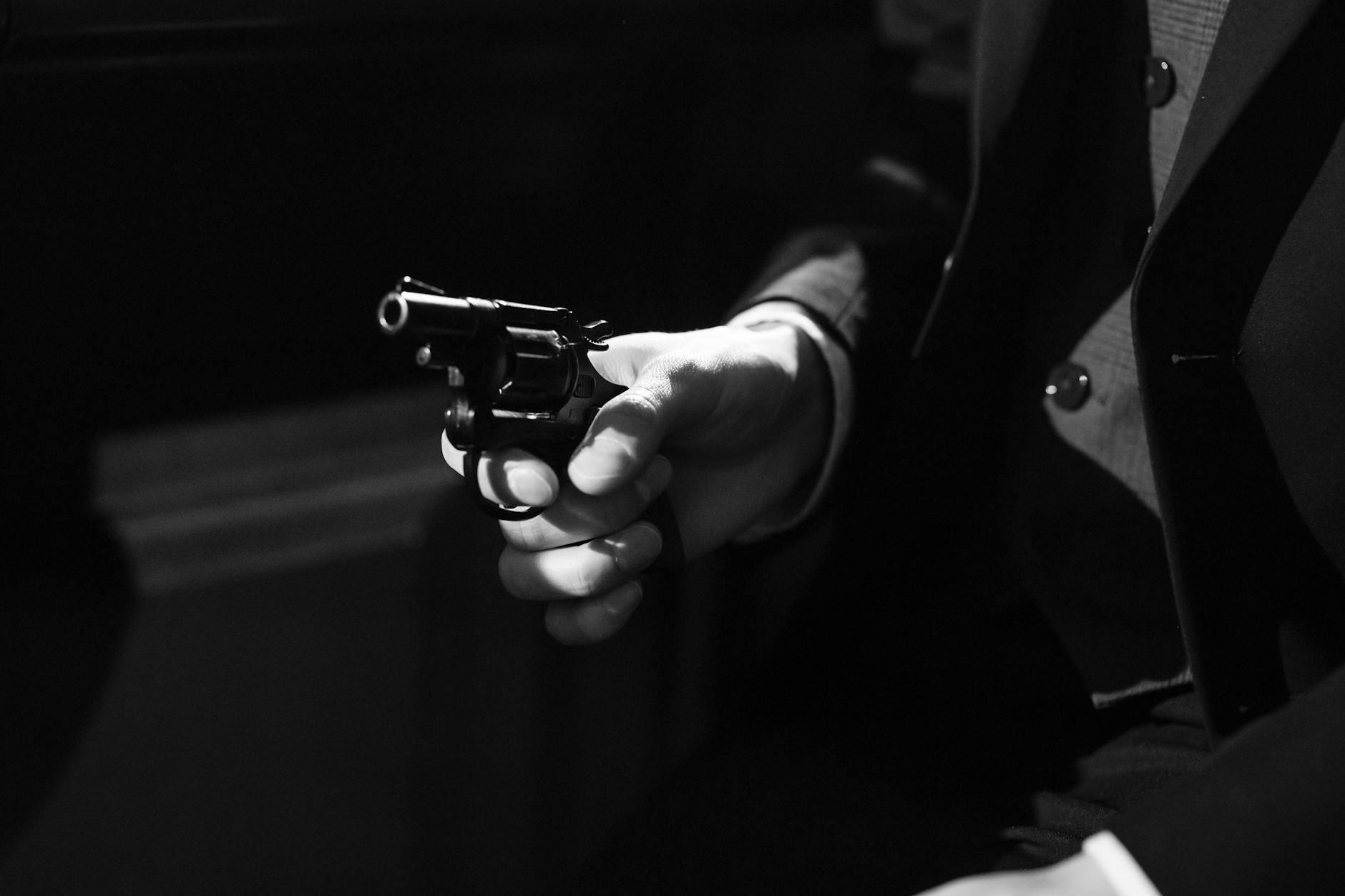 photo of person holding a handgun, Men´s Action Novels