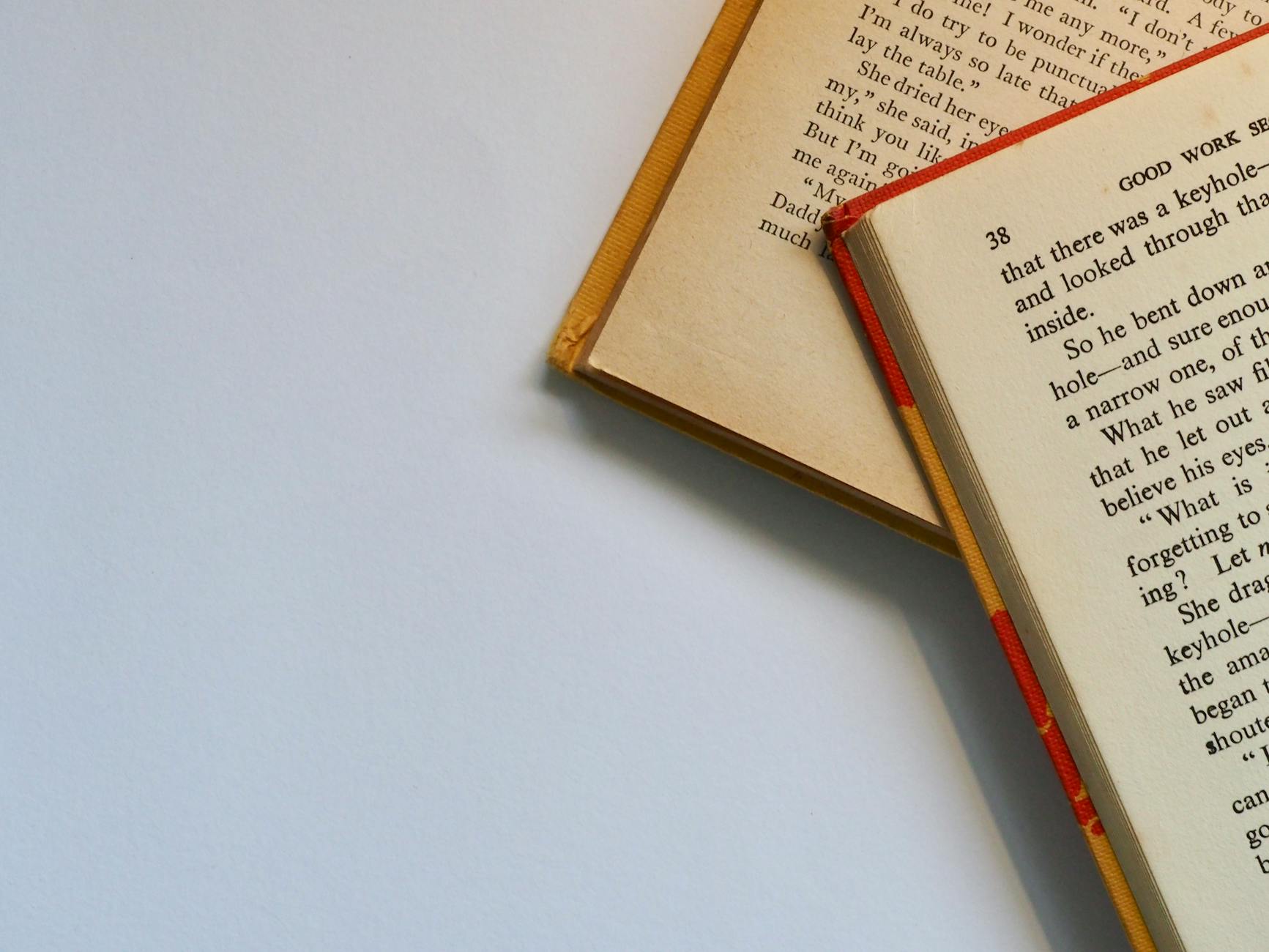 two red and white labeled books, Olive Kitteridge