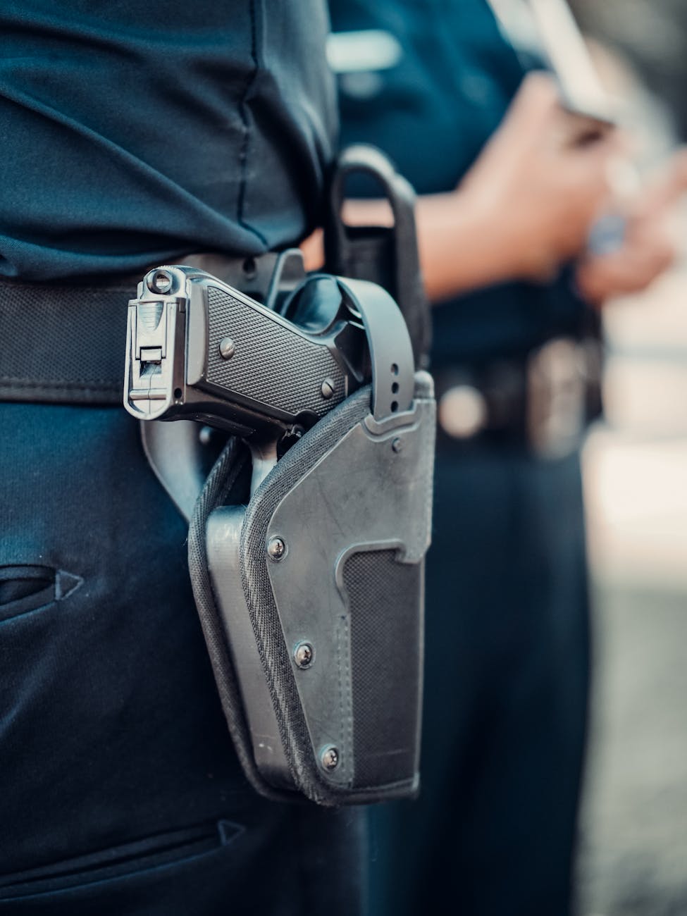 black semi automatic pistol on blue denim jeans, Detective Inspector 